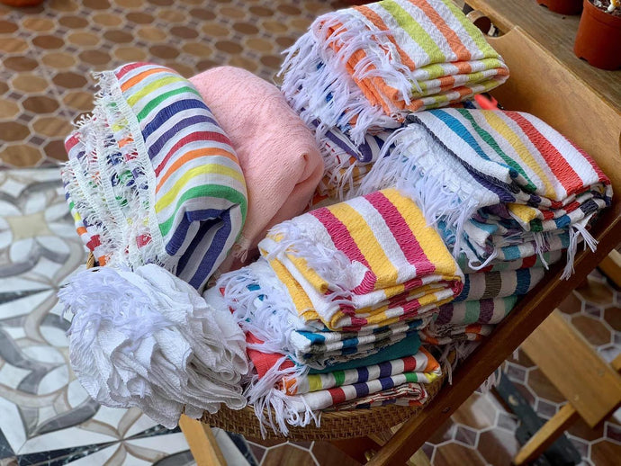 Hand-loomed queen-sized blankets, towels, and...