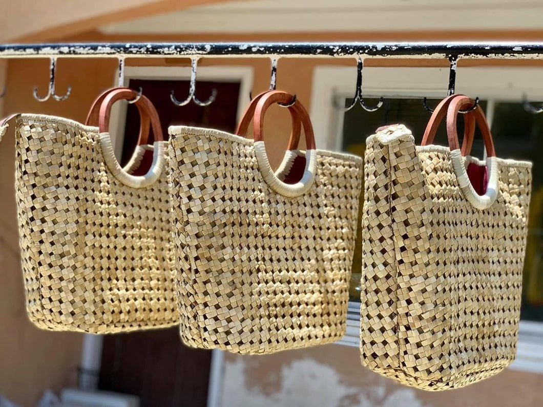 Handwoven pandan eyelet handbags