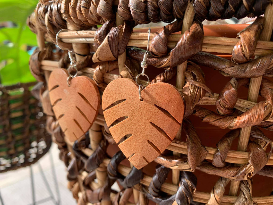 Hand-carved monstera leaf earrings made of mahogany wood