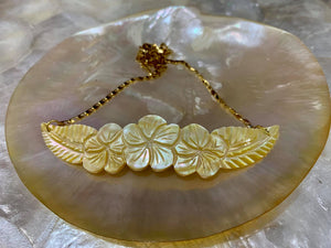 Hand-carved mother of pearl pendant in stainless steel gold