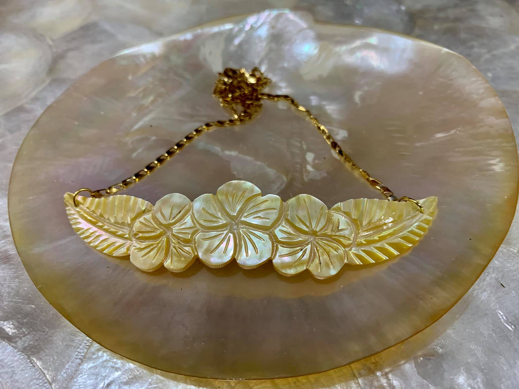 Hand-carved mother of pearl pendant in stainless steel gold