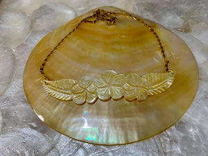 Hand-carved mother of pearl pendant in stainless steel gold